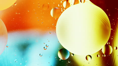 real abstract colourful oil drops in water rotation with color gradient mixing background