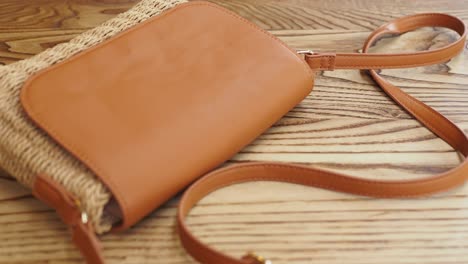 brown leather and woven crossbody bag