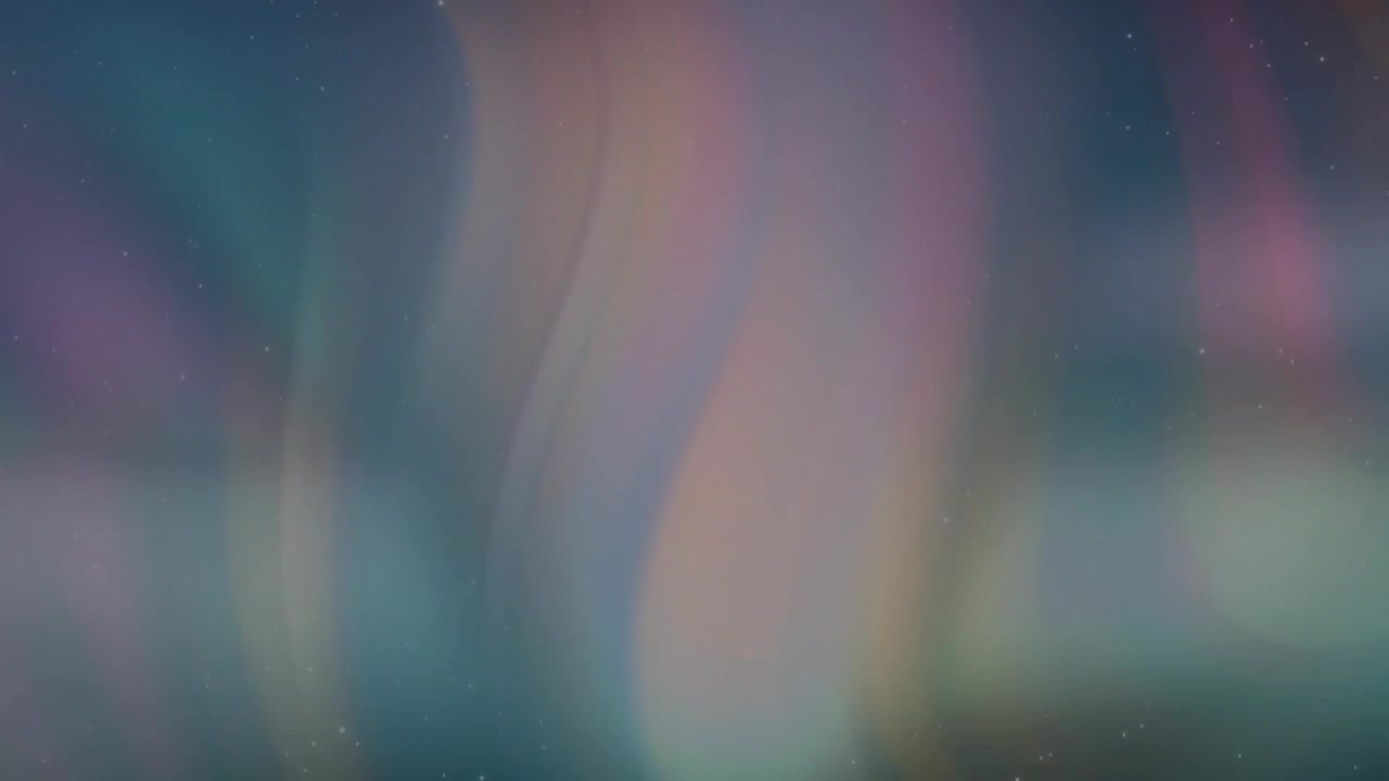 Faint colored light ribbons appearing near horizon growing, undulating and shifting across dark sky