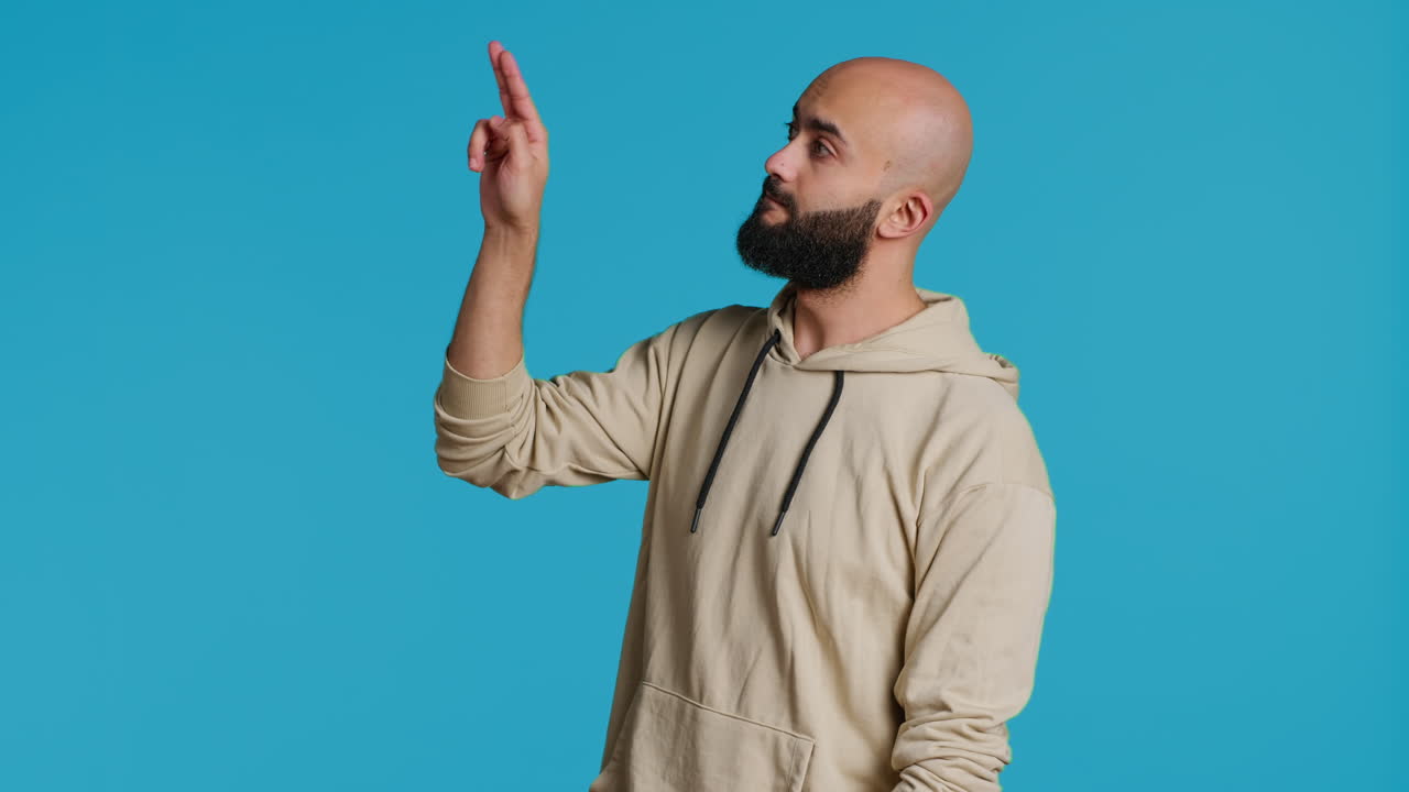 Arab man exploring artificial intelligence with holograms