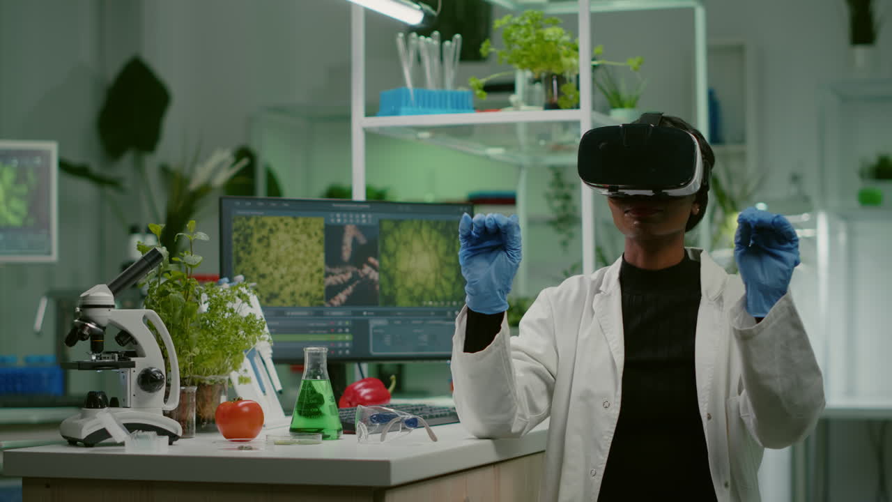 African biologist researcher with virtual reality headset researching new genetic experiment