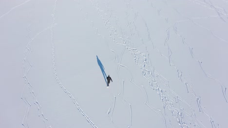 Aerial-view-of-tough-figure-ice-skating-at-Stamnes-Vestland-Norway---Top-down-aerial