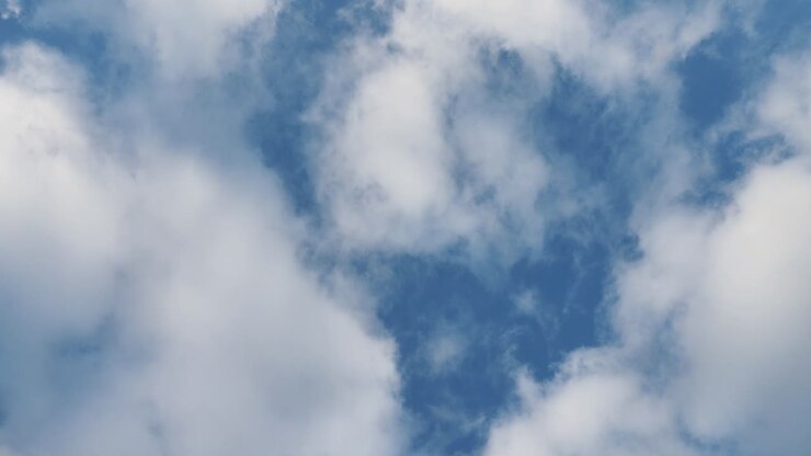 Airplane in Flight Over Clouds