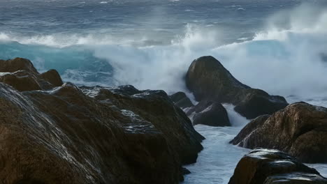 powerful ocean waves crashing on rocks