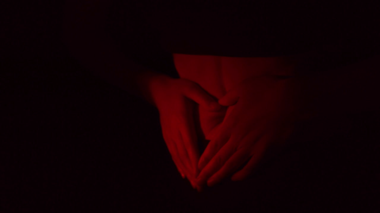 Woman holding her hands on her belly, because of belly ache. Abdoman pain and illness concept