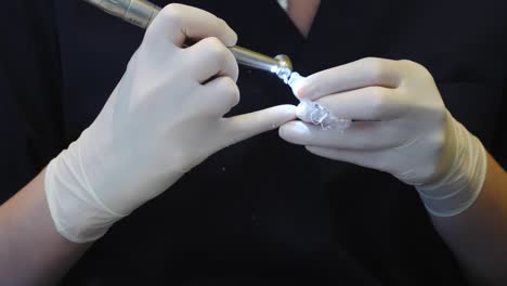 dental professional demonstrating an invisalign clear aligner, prepared for orthodontic treatment