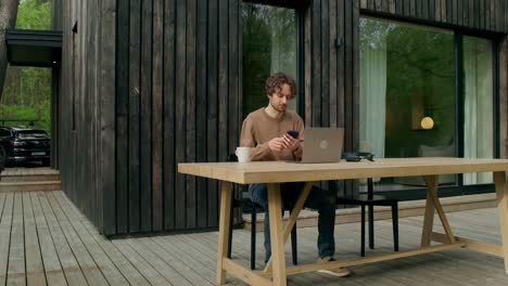 man working from home on a patio