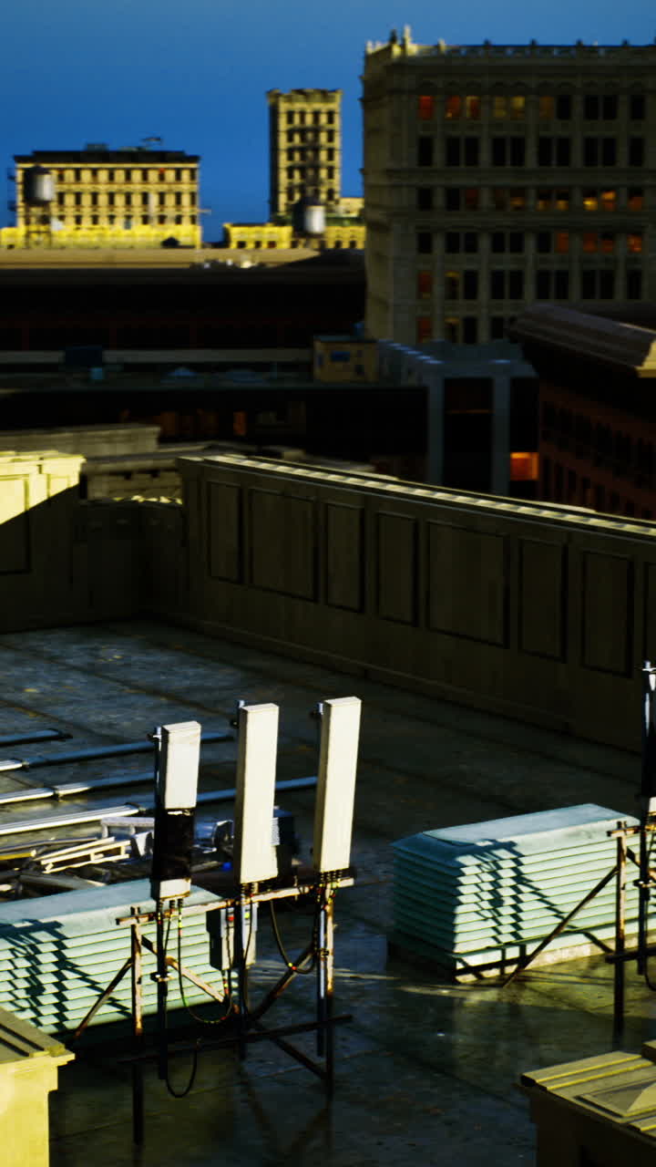 Rooftop construction work on a vibrant cityscape during sunset hours