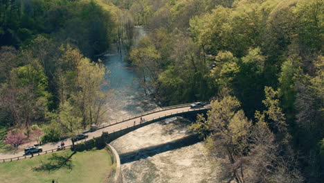 aerial view of croton river from the top of the dam wall with beautiful afternoon fun reflections in water and blue skies in the summer. slow motion 40fps.
