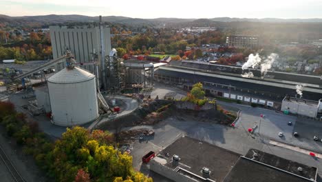 Aerial-of-factory-buildings-in-USA-during-autumn-fall-foliage-season