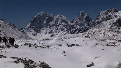 Mass-group-packing-snow-down-to-make-landing-pad