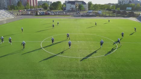 american football players practicing on a field