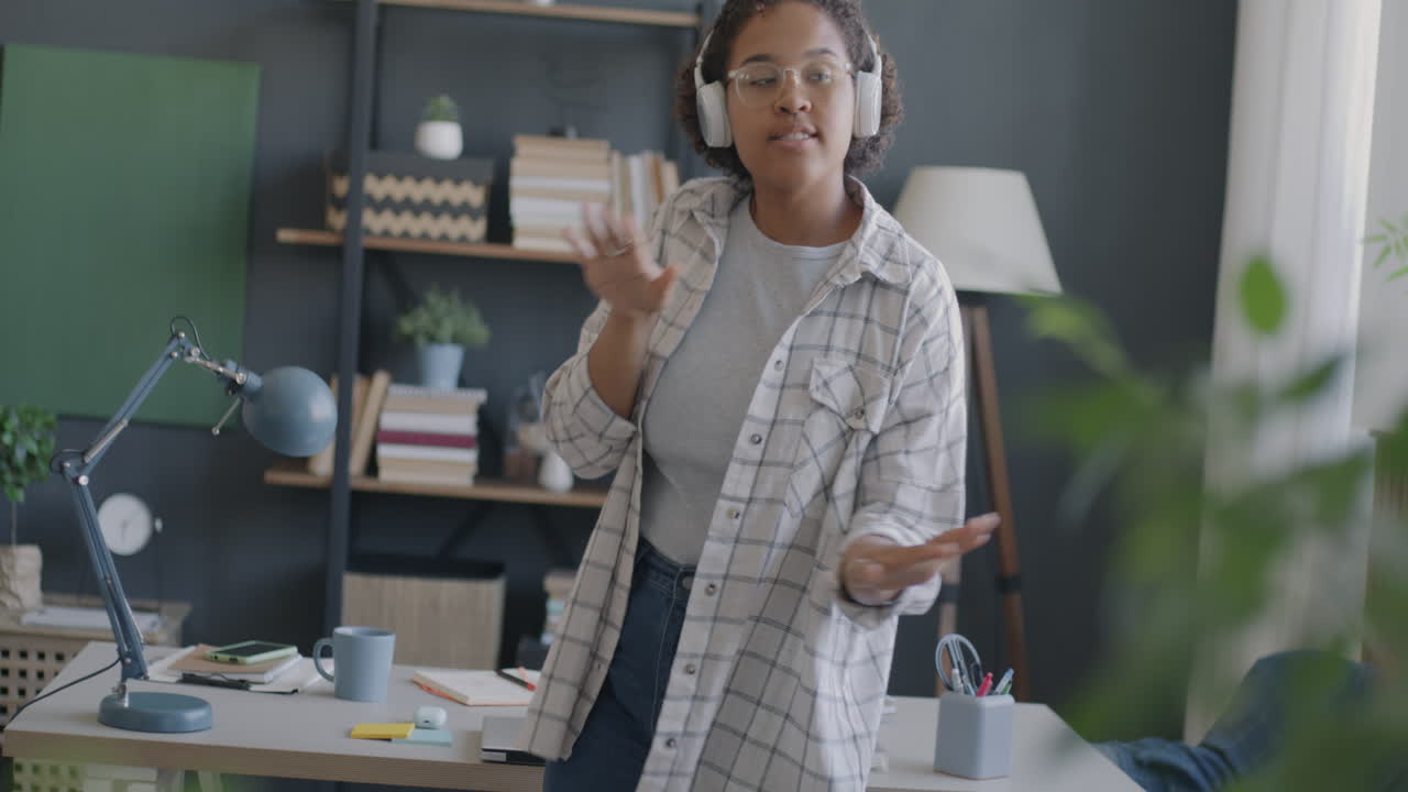 Woman Dancing to Music at Home