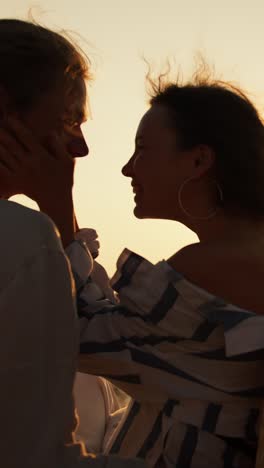 couple at sunset on a wooden dock