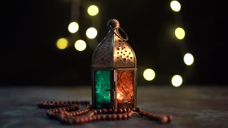 arabic lantern and tasbih (prayer beads beads)