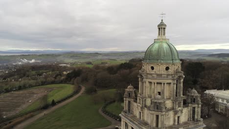 aerial view landmark historical copper dome building ashton memorial english countryside close to pull back rising