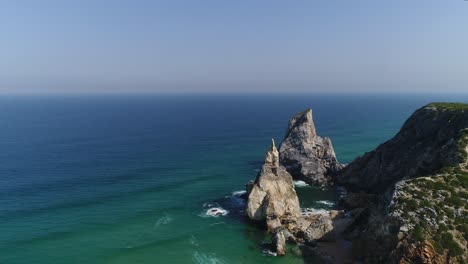 Aerial-View-of-Praia-da-Ursa-is-a-deserted-beach-located-in-Sintra,-Portugal