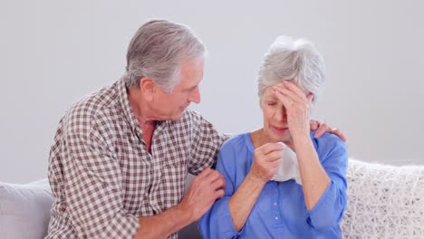 Kind-elderly-husband-comforting-his-wife