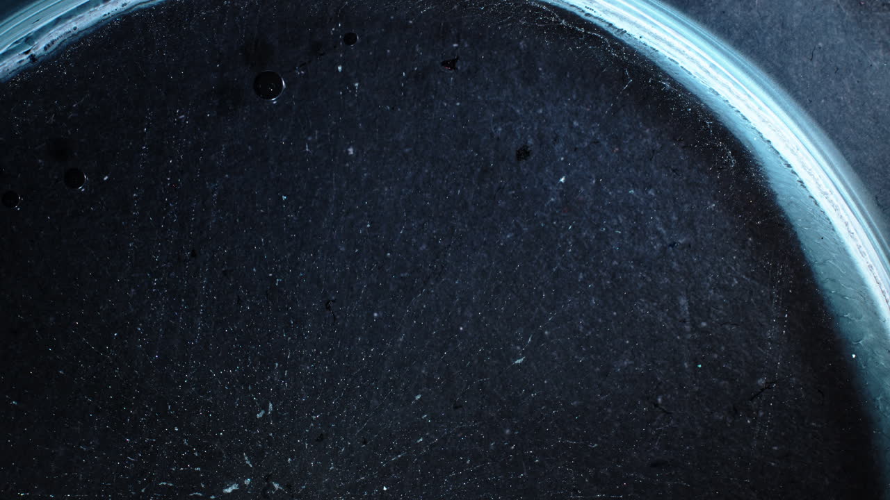 Close-up of substances mixing in a macro shot showcasing texture