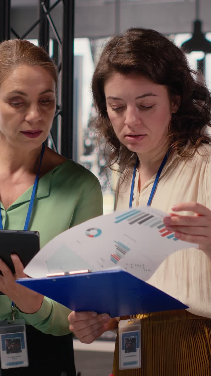 Vertical Video Ambitious professionals demonstrating teamwork to build business strategy