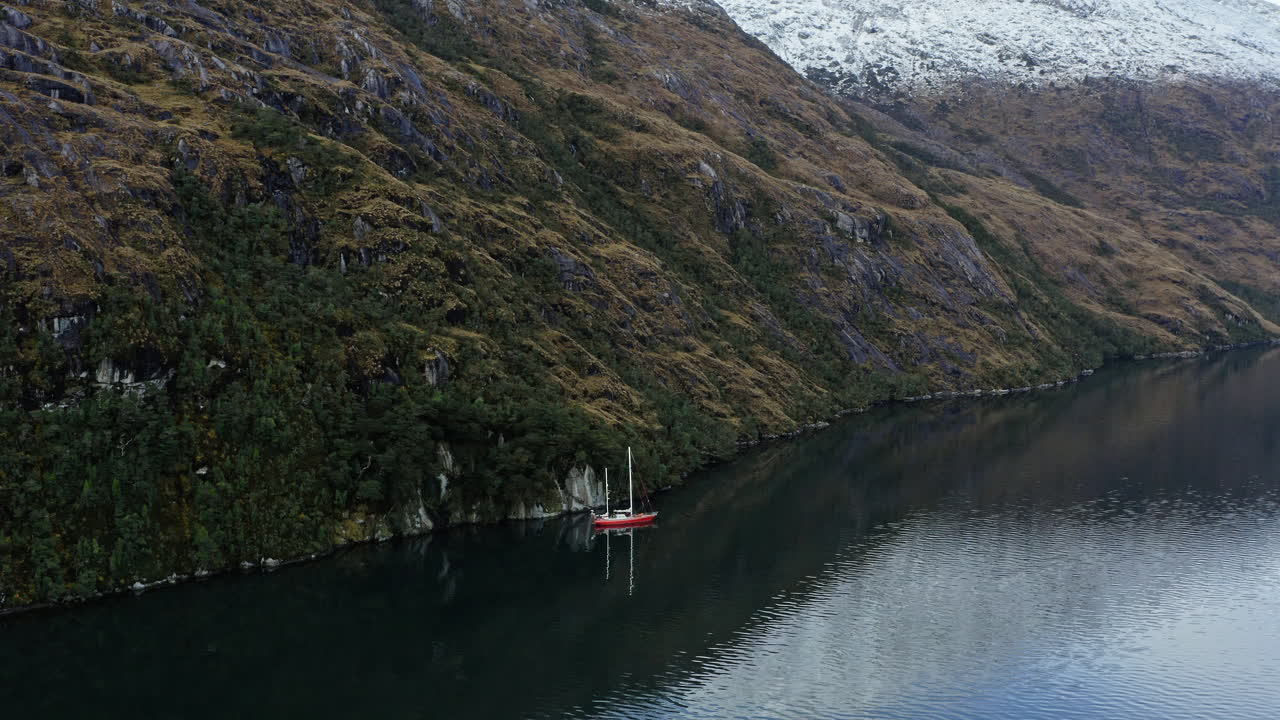 Idyllic View Of A Boat Charter Across The Strait Of Beagle Channel Near Cape Horn In Argentina. Aerial Drone Shot