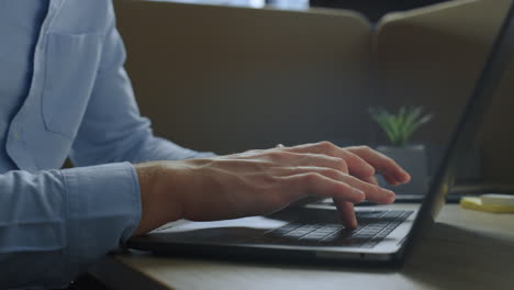 businessman hands using touchpad on laptop. employee typing on computer keyboard