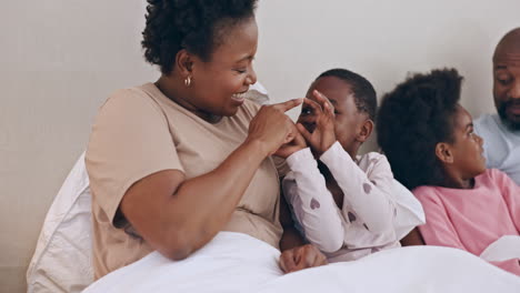 Happy,-tickling-and-black-family-having-fun-in-bed