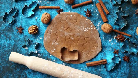 christmas baking concept  gingerbread dough with different cutter shapes