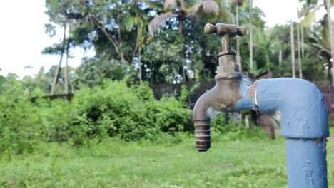 Water-leak-from-a-tap-in-rural-area-|-4K