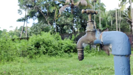 water leak from a tap in rural area | 4k