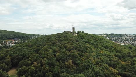 castle königstein on a hill, germany, flying towards and above it