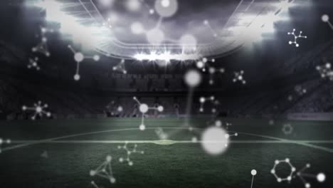 Animation-of-molecules-over-empty-sports-stadium
