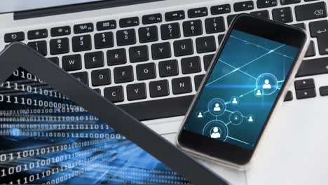 Animation of smartphone showing web of connections and digital tablet with data processing on the sc
