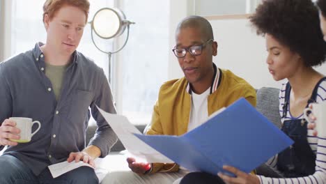 Diverse-group-of-male-and-female-business-colleagues-working-in-office