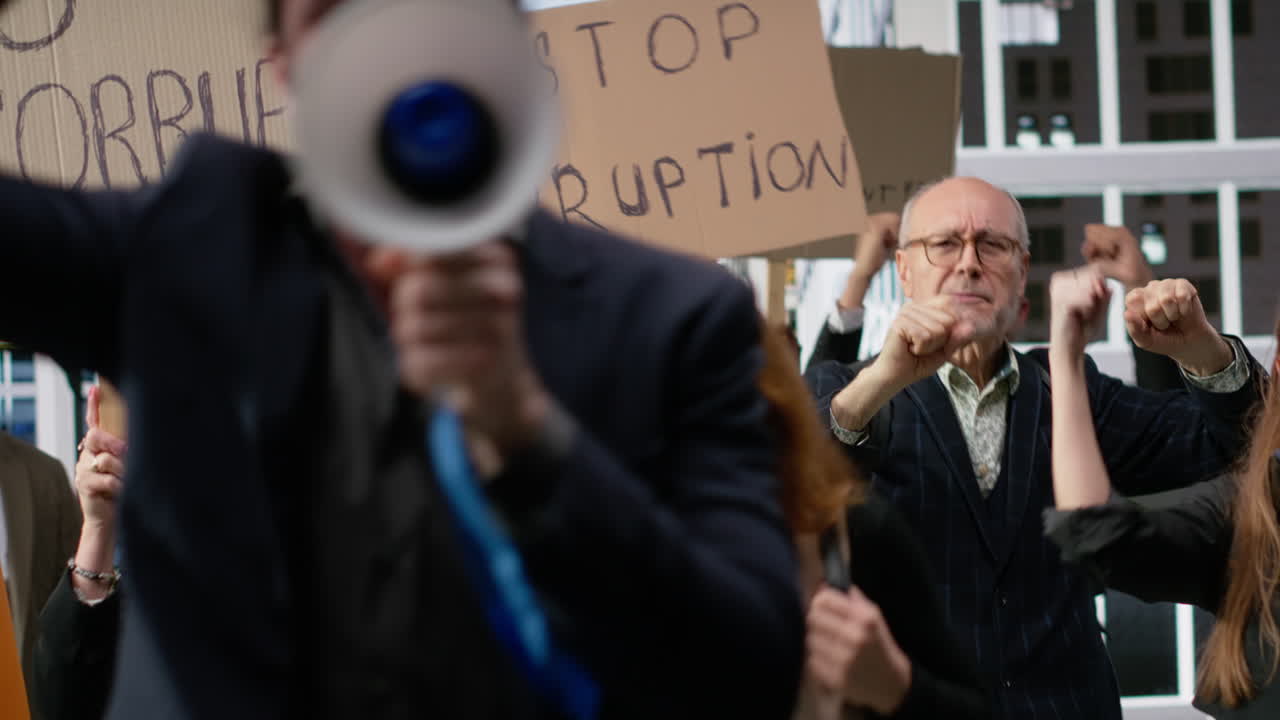 Activists marching together in political protest against corruption and misconduct