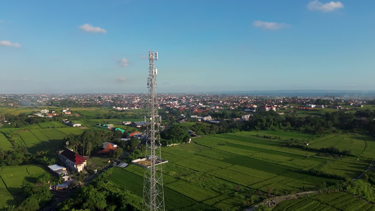 Rare Stunning Drone Aerial Circle Telecommunication Tower Wireless Internet WiFi 5G Above Countryside Landscape in Green Rice Fields during day in 4K