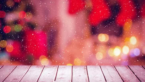 nieve cayendo con casa de navidad y madera