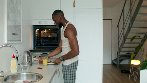 man eating breakfast in modern kitchen