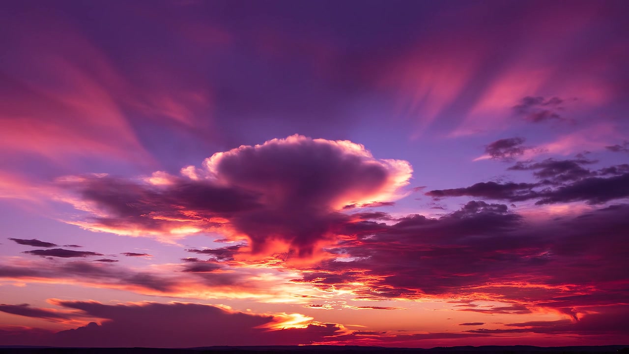 Vibrant Purple and Orange Sunset Sky with Dramatic Clouds