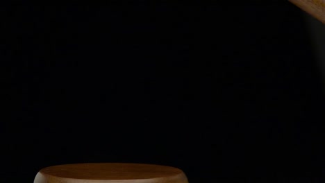 wooden gavel on black background