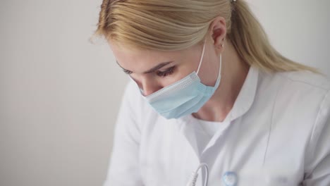 hardware procedure in cosmetology. peeling, phonophoresis, massage and facelift in a beauty clinic. cosmetologist smoothes wrinkles with microcurrent.