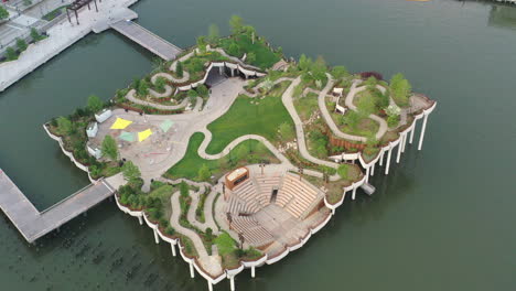 an aerial view over manhattan's little island, a public green space taken on a sunny day