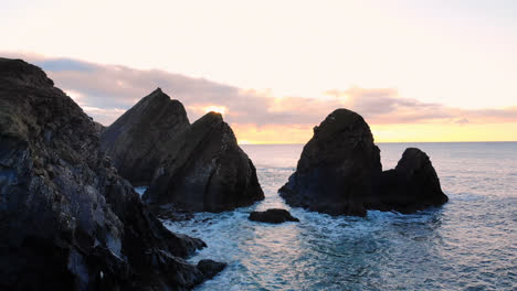 Rock-formation-in-sea-at-dusk-4k