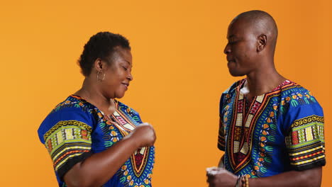 Playful-ethnic-couple-doing-fist-bump-gesture-on-camera