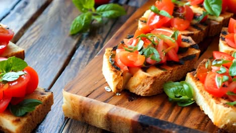 a wooden cutting board topped with slices of bread covered in tomatoes and basil