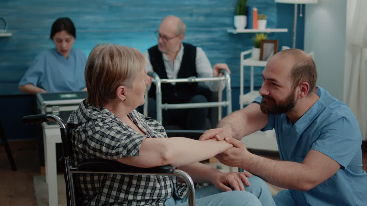Aged woman with handicap getting support from nurse