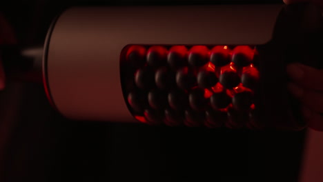 close up of a red light massage tool