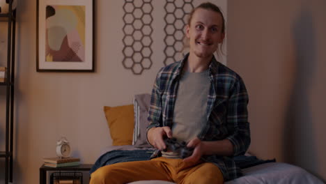 Man Playing Video Game in Bedroom