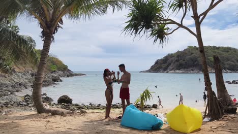 couple enjoying a tropical beach vacation