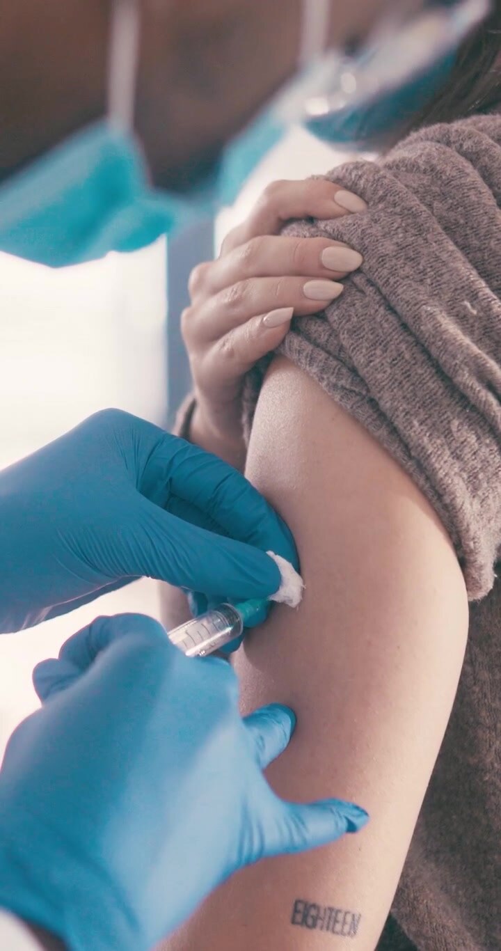 Medical Professional Administering Vaccine Injection to Patient